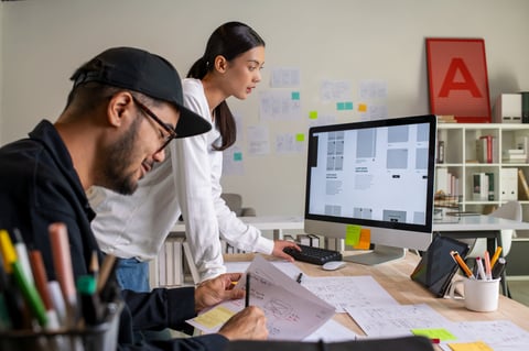 UX UI designers brainstorming wireframes and prototypes