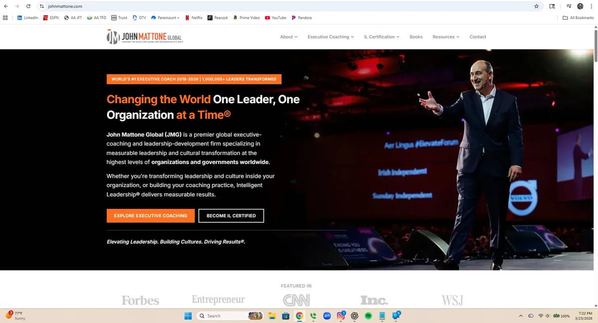 Business leadership website header with tagline Changing the World One Leader, One Organization at a Time and professional man speaking on stage