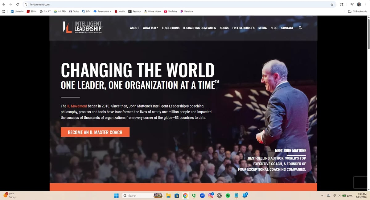 Website banner showing a leadership coach speaking to an audience with text Changing the World, One Leader, One Organization at a Time